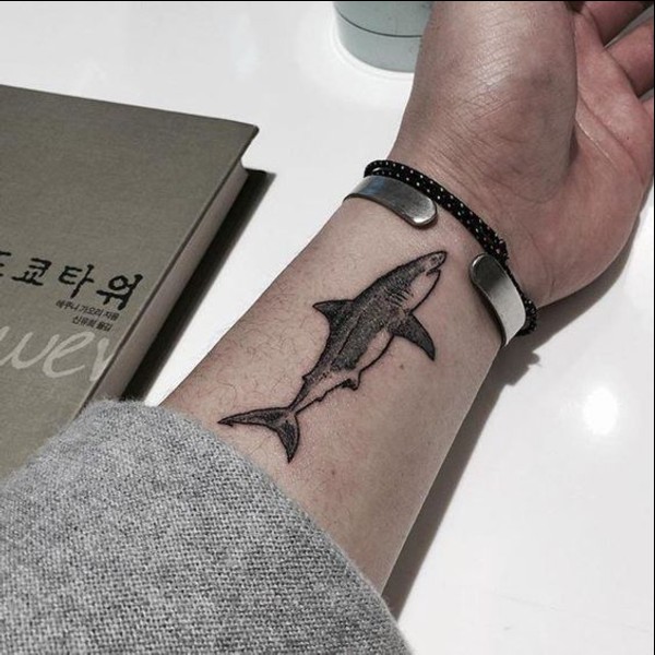fish tattoo on inner wrist