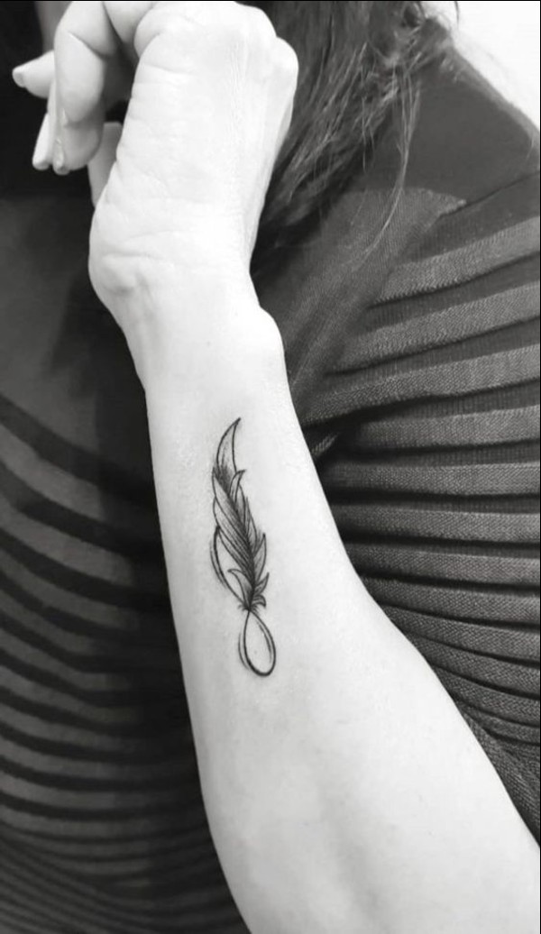 feather side wrist tattoos