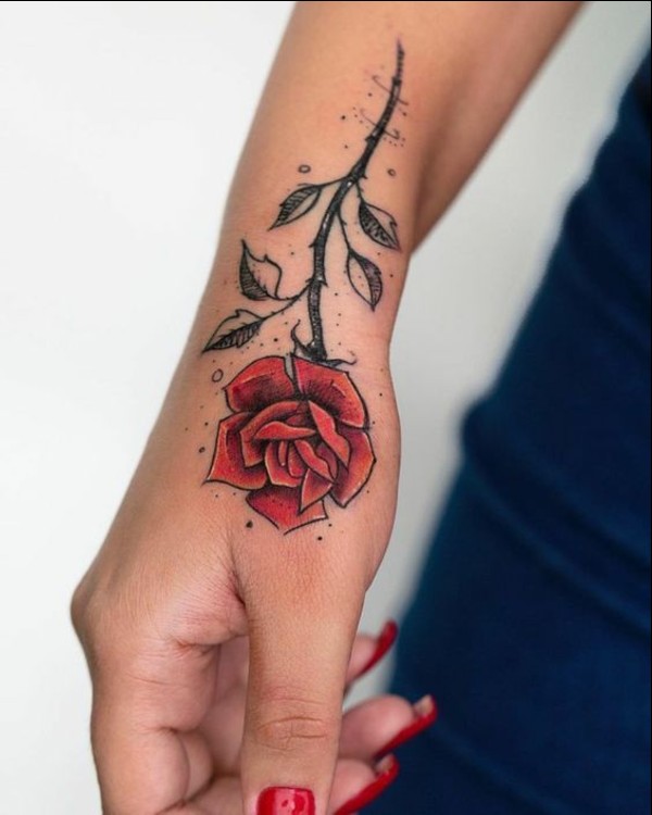 Red Ink Sanskrit Wrist Tattoo