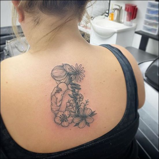 motherhood symbol tattoos