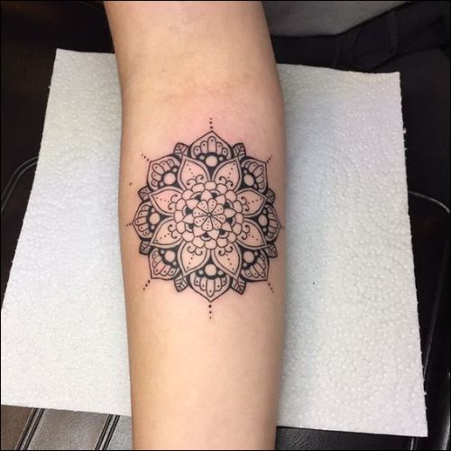 lotus mandala tattoo on inner forearm