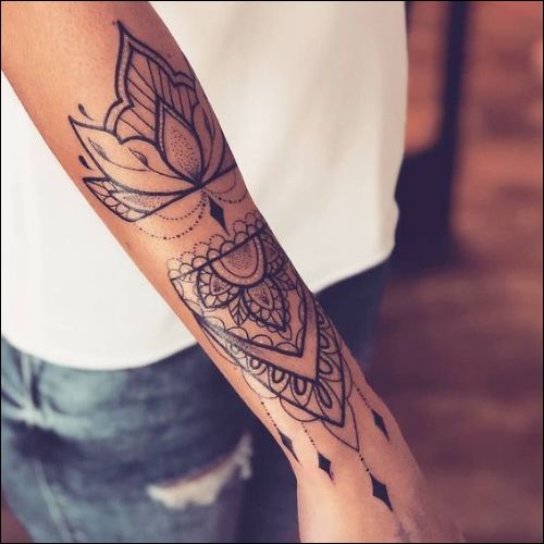 Lotus mandala tattoo on forearm and wrist