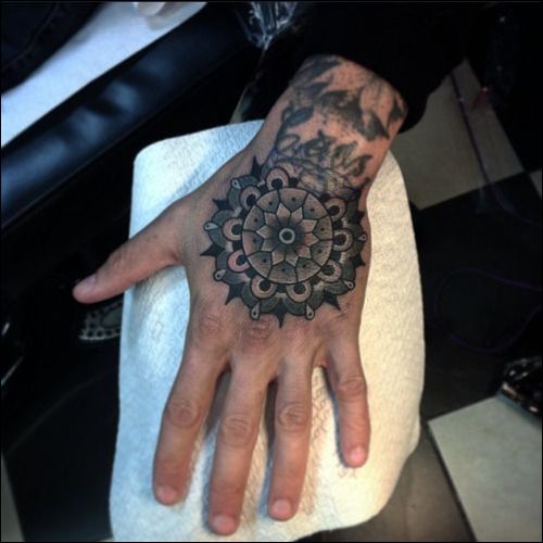 mandala lotus on hand tattoo