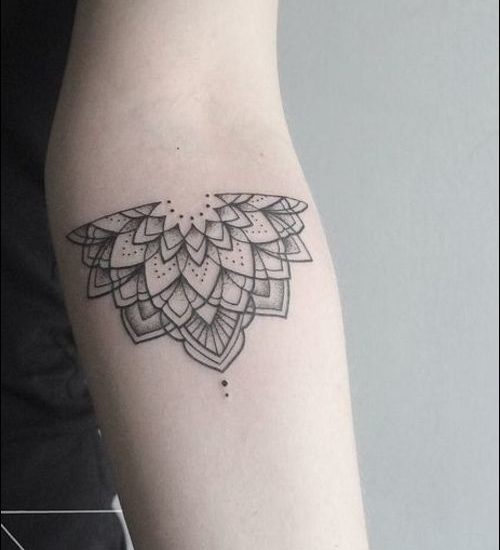 quarter lotus mandala tattoo on inner forearm