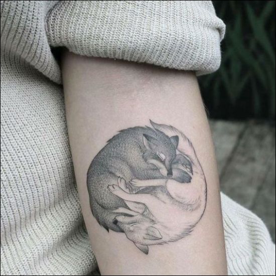 black and white wolf tattoos designs on inner forearm