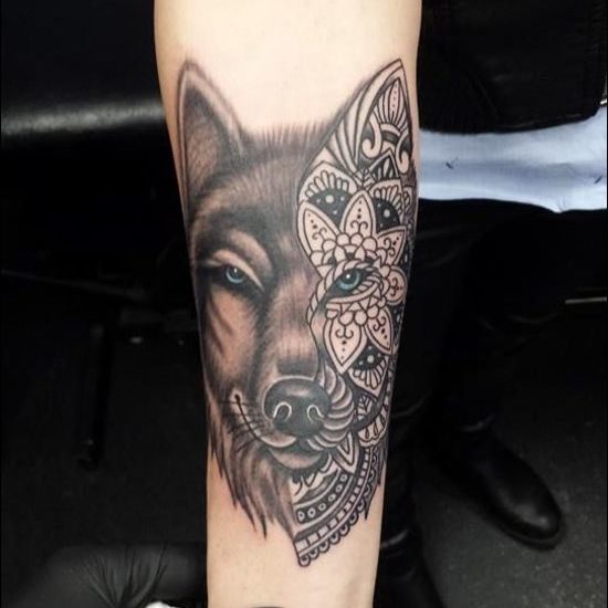 Wolf and flowers tattoo designs on the inner forearm