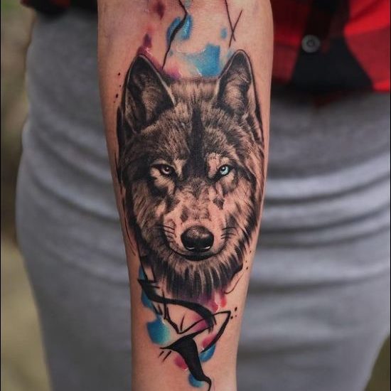 Watercolor wolf tattoos on inner forearm