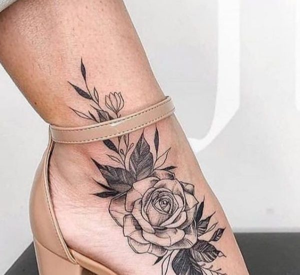 Dark red rose tattoo on ankle