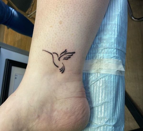 tiny bird tattoo on ankle