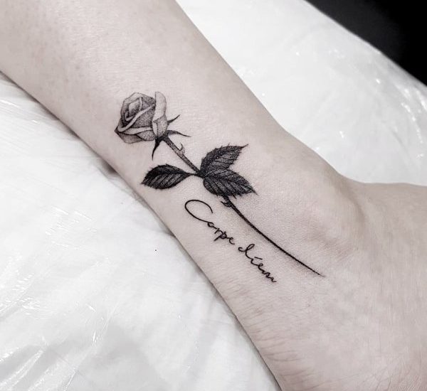 dark red rose with quote on ankle