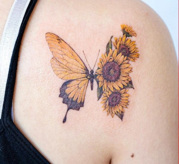 Sunflower and butterfly tattoo on shoulder
