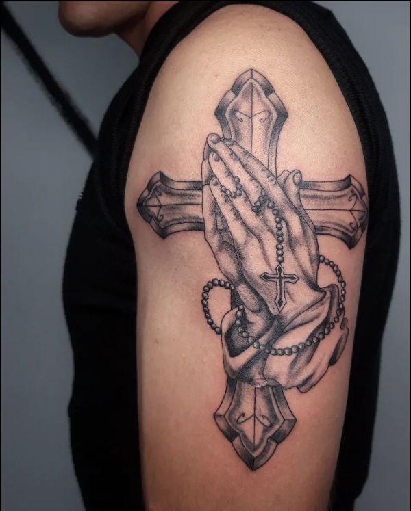 praying hand with cross tattoo on shoulder