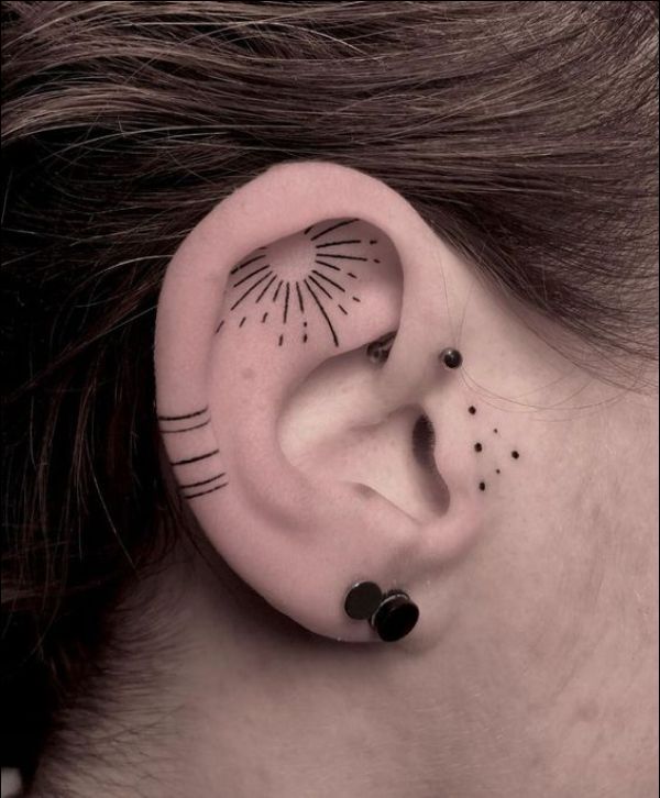 sun tattoo on ear