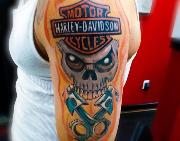 Harley Davidson with skull and flames designs on the shoulder
