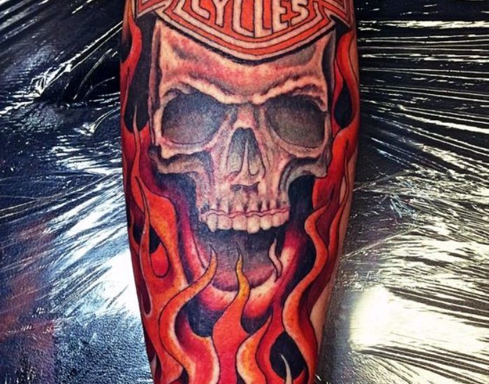 Skull with flames Harley Davidson tattoo designs on leg