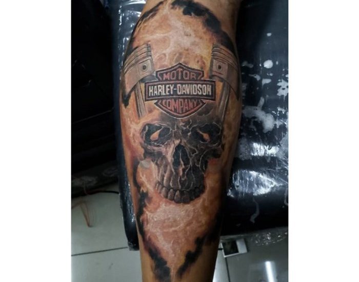 Harley Davidson engine and skull with flames tattoos