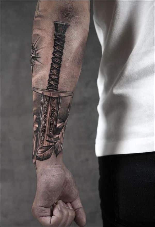 Katana tattoo located on the inner forearm