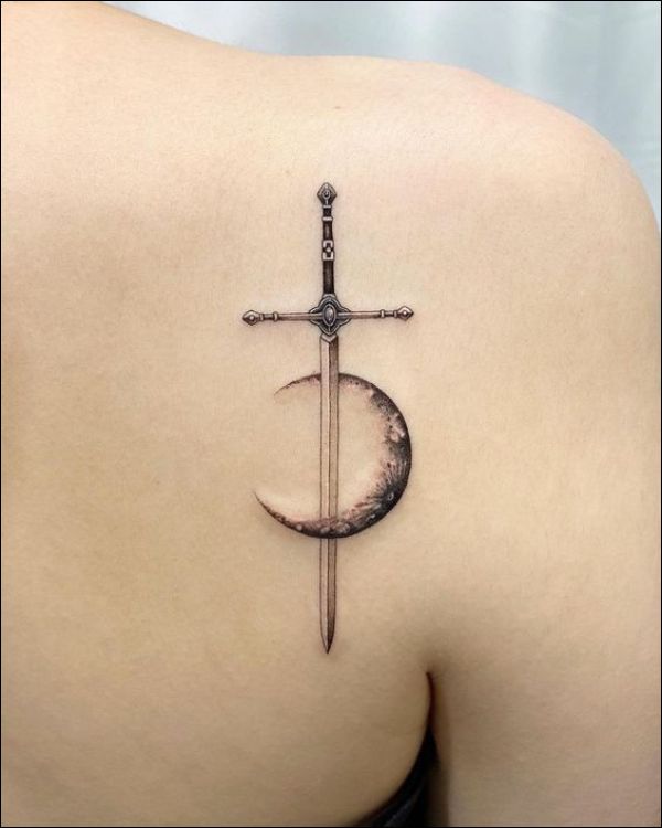 Sword tattoo on the left forearm