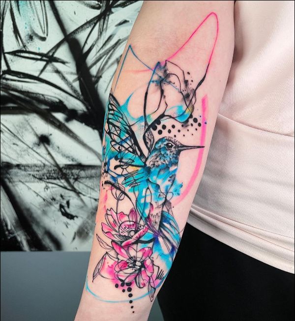 hummingbird and flower tattoo design on arm