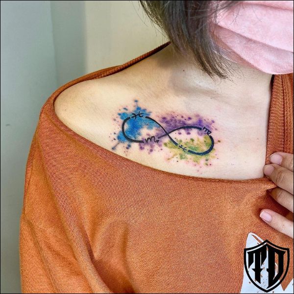 infinity watercolor tattoo design on collarbone
